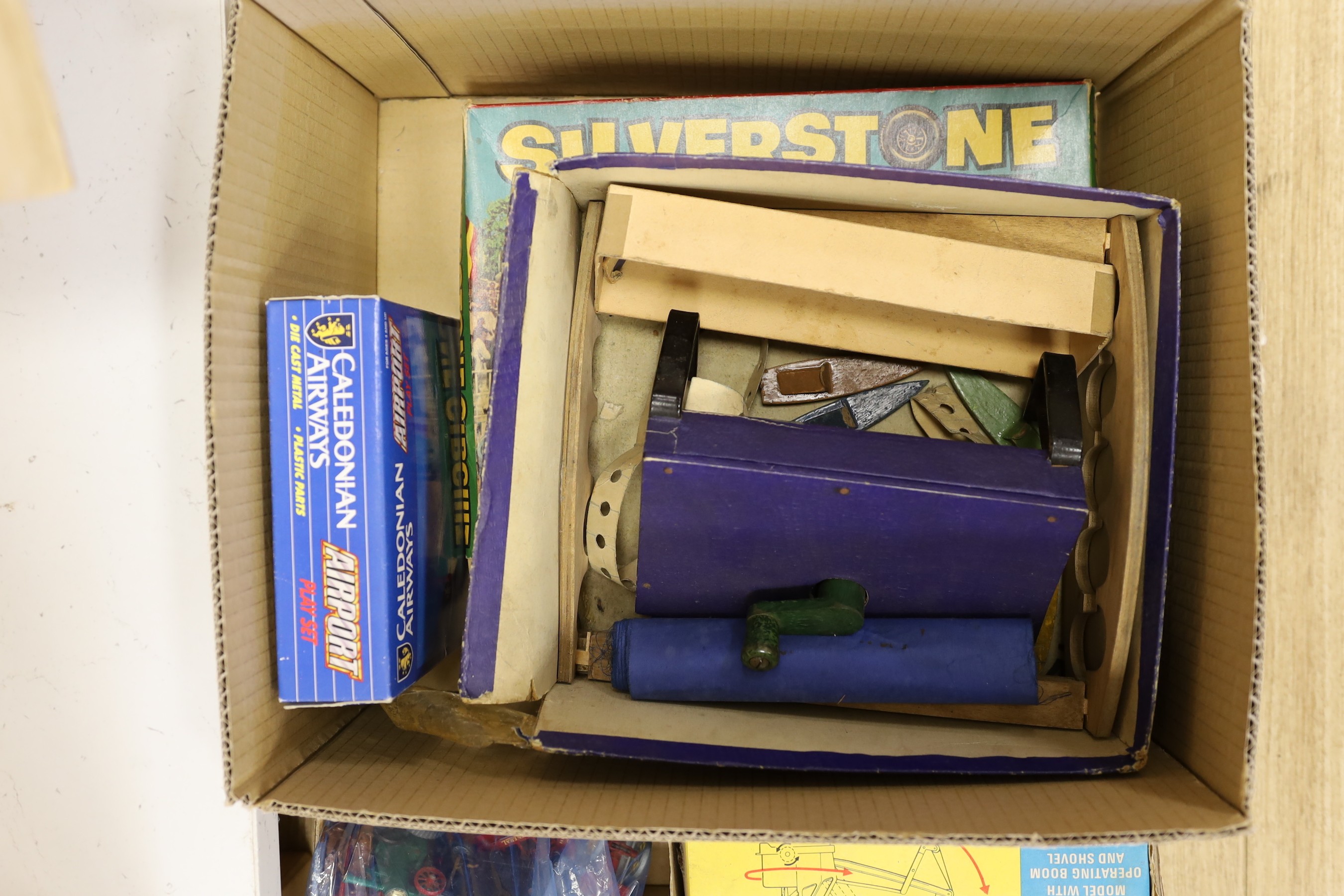 A collection of die-cast toys and boxed games